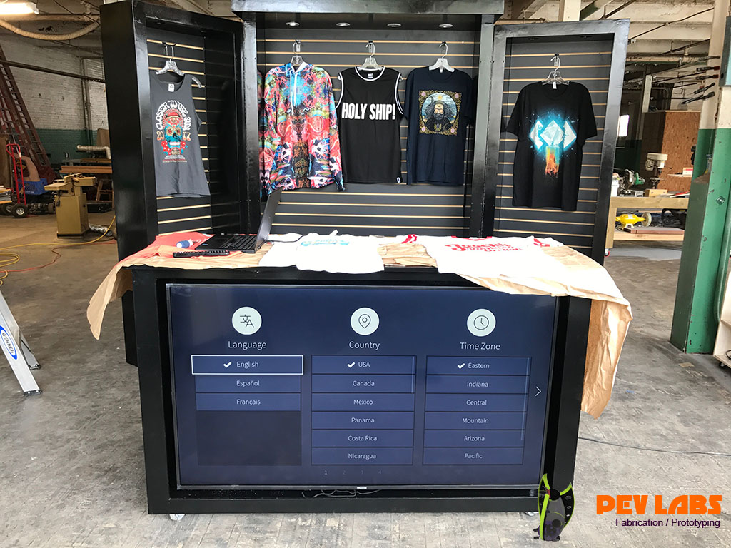 TV Screen in Large Custom Merchandise Cabinetry TV Screen in Large Custom Merchandise Cabinetry